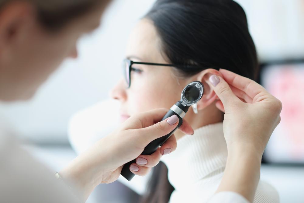 Otorhinolaryngologist,Examines,Patient,Ear,With,An,Otoscope